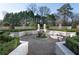 Charming formal garden featuring manicured hedges, a central fountain, and inviting benches for relaxation at 2500 Peachtree Nw Rd # 605S, Atlanta, GA 30305