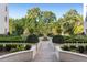 Picturesque garden with meticulously manicured hedges, a central fountain, and neatly laid brick paths at 2500 Peachtree Nw Rd # 605S, Atlanta, GA 30305