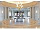 Elegant lobby features marble flooring, decorative chandelier, columns, and floral arrangements at 2500 Peachtree Nw Rd # 605S, Atlanta, GA 30305