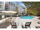 Community pool surrounded by lounge chairs and tables, offers a relaxing outdoor space at 2500 Peachtree Nw Rd # 605S, Atlanta, GA 30305