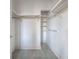 Well-organized walk-in closet with shelving and hanging rods for storage at 2500 Peachtree Nw Rd # 605S, Atlanta, GA 30305