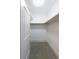 Walk-in closet with ample storage space and neutral carpeting at 2500 Peachtree Nw Rd # 605S, Atlanta, GA 30305