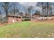 Large backyard with a deck, outdoor fire pit, and lush lawn at 2722 Oswood Dr, Tucker, GA 30084