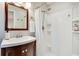 Bathroom features a single vanity and walk-in shower with white subway tile at 2722 Oswood Dr, Tucker, GA 30084