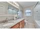 Bathroom features a double sink vanity with granite countertops and a large mirror at 2722 Oswood Dr, Tucker, GA 30084