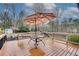 Deck featuring a table and chair, and umbrella at 2722 Oswood Dr, Tucker, GA 30084