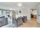 Bright living room showing hardwood floors, large windows, and access to the kitchen at 2722 Oswood Dr, Tucker, GA 30084