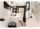 Bright bathroom featuring classic fixtures, hexagon tile floor and black/white color scheme at 7121 Forest Se Dr, Covington, GA 30014