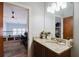 Bathroom features a granite countertop, modern sink, and neutral color palette at 1253 Caroline Ne St, Atlanta, GA 30307