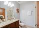 Updated bathroom features granite countertop, modern fixtures, and glass-enclosed shower at 1253 Caroline Ne St, Atlanta, GA 30307