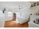Bright bedroom with large windows, hardwood floors, and a cozy bed with soft textures at 1253 Caroline Ne St, Atlanta, GA 30307