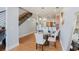 Cozy dining room featuring a round table, staircase, and adjacent breakfast bar area at 1253 Caroline Ne St, Atlanta, GA 30307