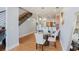Dining area featuring a glass table, modern chairs, and hardwood floors at 1253 Caroline Ne St, Atlanta, GA 30307