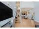 Bright living room with hardwood floors and open staircase leading to upper level at 1253 Caroline Ne St, Atlanta, GA 30307