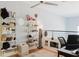 Loft with decorative shelving, workstation, and a ceiling fan at 1253 Caroline Ne St, Atlanta, GA 30307