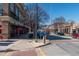 A vibrant street scene with shops, restaurants, and parked cars under a clear sky at 1253 Caroline Ne St, Atlanta, GA 30307