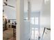 View of the second story showing a desk area, hardwood floors, and large bright windows at 1253 Caroline Ne St, Atlanta, GA 30307