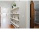 Hallway with hardwood floors and floating shelves at 1253 Caroline Street Northeast Ne, Atlanta, GA 30307