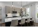 Contemporary kitchen with stainless appliances, large island, and stylish pendant lights at 2036 Bixby Byway Se Dr, Atlanta, GA 30317