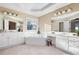 Bright bathroom featuring a soaking tub, double sinks, and vanity area at 514 Lovinggood Ct, Woodstock, GA 30189