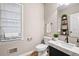 Bathroom featuring modern fixtures, countertop, and a decorative shelf at 514 Lovinggood Ct, Woodstock, GA 30189