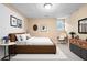 Neutral primary bedroom with a walk-in closet, a dresser and simple decor and a large window at 514 Lovinggood Ct, Woodstock, GA 30189