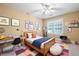 Bedroom with a ceiling fan, window and decoratively adorned with colorful pictures and a playful rug at 514 Lovinggood Ct, Woodstock, GA 30189