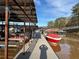 View of the community boat dock on the lake with boats ready to hit the water and enjoy lake living at 514 Lovinggood Ct, Woodstock, GA 30189