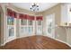 Sunny breakfast nook with hardwood floors and lots of natural light at 514 Lovinggood Ct, Woodstock, GA 30189