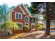 Charming two-story red brick home with manicured landscaping at 514 Lovinggood Ct, Woodstock, GA 30189