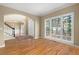 Bright living room featuring large windows and hardwood floors at 514 Lovinggood Ct, Woodstock, GA 30189