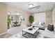 Open concept living area with a dining table, neutral walls, and modern decor for a relaxing atmosphere at 514 Lovinggood Ct, Woodstock, GA 30189