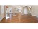 Open-concept living area with hardwood floors and ample natural light at 514 Lovinggood Ct, Woodstock, GA 30189