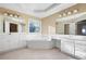 Spacious main bathroom with double vanities, a soaking tub, and bright natural light at 514 Lovinggood Ct, Woodstock, GA 30189