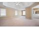 Expansive main bedroom features a tray ceiling, neutral walls, and an en suite bathroom at 514 Lovinggood Ct, Woodstock, GA 30189