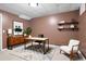 Stylish home office featuring modern furniture, a decorative rug, and ample lighting for productivity at 514 Lovinggood Ct, Woodstock, GA 30189
