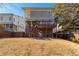 Exterior of house with two-story deck, privacy fence and expansive backyard at 2629 Apple Valley Ne Rd, Brookhaven, GA 30319