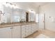 Bright bathroom with granite counters, double sinks, white cabinetry, and tiled flooring at 2629 Apple Valley Ne Rd, Brookhaven, GA 30319