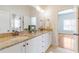 Bathroom featuring a double vanity with granite counters, white cabinets and bronze fixtures at 2629 Apple Valley Ne Rd, Brookhaven, GA 30319