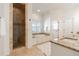 Bright bathroom with a tiled shower, soaking tub, granite counters, and neutral finishes at 2629 Apple Valley Ne Rd, Brookhaven, GA 30319