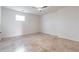 Bright bedroom with tiled floor, a window and neutral color palette at 2629 Apple Valley Ne Rd, Brookhaven, GA 30319