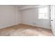 Bedroom featuring a window and tiled floor, with neutral color palette at 2629 Apple Valley Ne Rd, Brookhaven, GA 30319