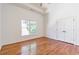 Bright bedroom with hardwood floors, a large window, double door closet, and neutral finishes at 2629 Apple Valley Ne Rd, Brookhaven, GA 30319