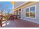 Exterior view of a deck overlooking the backyard, with light grey siding and view to the screened porch at 2629 Apple Valley Ne Rd, Brookhaven, GA 30319