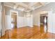 Dining room with hardwood floors, coffered ceilings, and multiple entryways at 2629 Apple Valley Ne Rd, Brookhaven, GA 30319