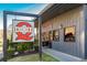 Charming restaurant exterior featuring a large Dixie Q sign, sidewalk and lush green landscaping at 2629 Apple Valley Ne Rd, Brookhaven, GA 30319