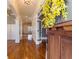 Inviting foyer featuring gleaming hardwood floors and decorative trim work, seen through the opened front door at 2629 Apple Valley Ne Rd, Brookhaven, GA 30319