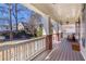 Relax on this covered front porch with rocking chair and white railing; perfect for enjoying the outdoors at 2629 Apple Valley Ne Rd, Brookhaven, GA 30319