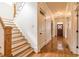 Hallway with wood flooring, stairway, and view of entry door at 2629 Apple Valley Ne Rd, Brookhaven, GA 30319