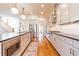 Well-lit kitchen featuring stainless steel appliances, white cabinets, and a kitchen island with pendant lighting at 2629 Apple Valley Ne Rd, Brookhaven, GA 30319